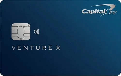 Capital One Venture X premium travel credit card on a dark blue background.